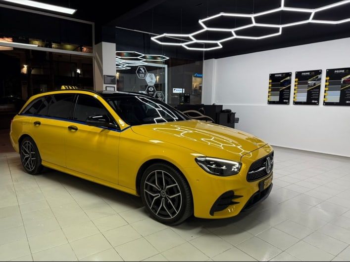 Yellow Mercedes-Benz Athens taxi with a roof sign, part of the MX Transfers fleet